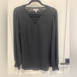Maurice’s black v-neck blouse with elastic at wrists